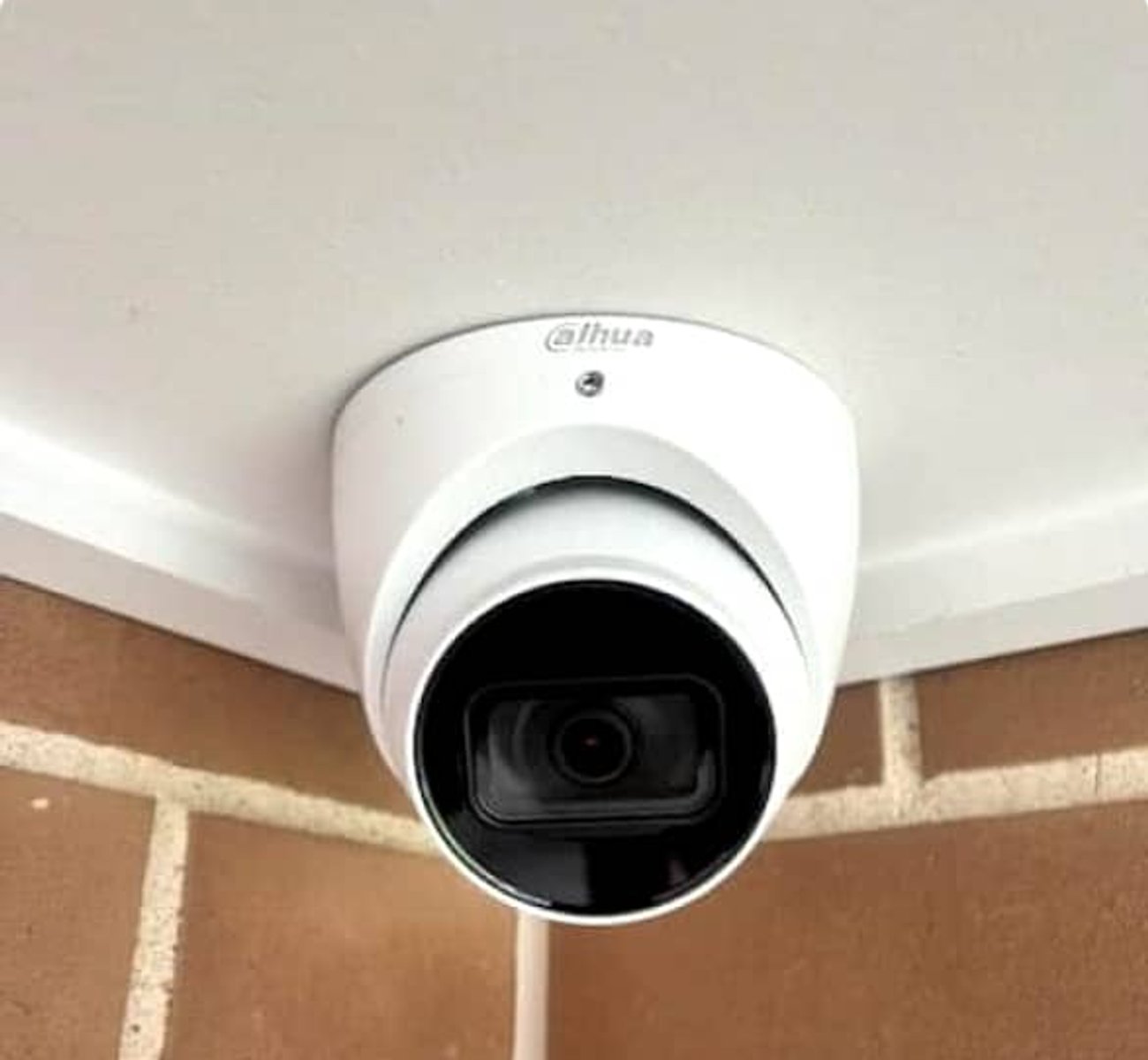 Security technician installing CCTV camera