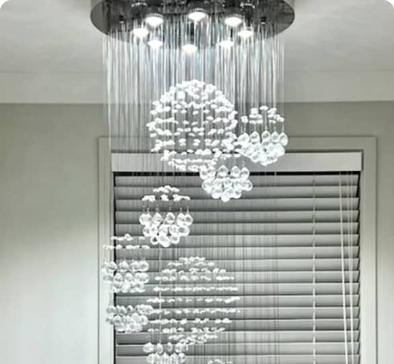 ESER Electrical team installing a grand chandelier