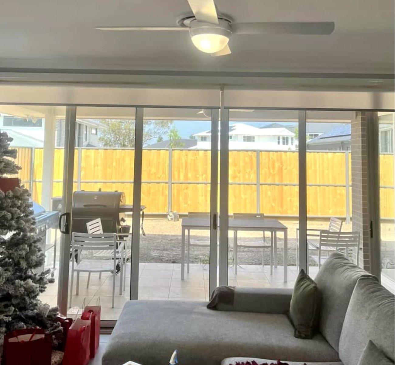 Satisfied customer enjoying a newly installed ceiling fan in their living room