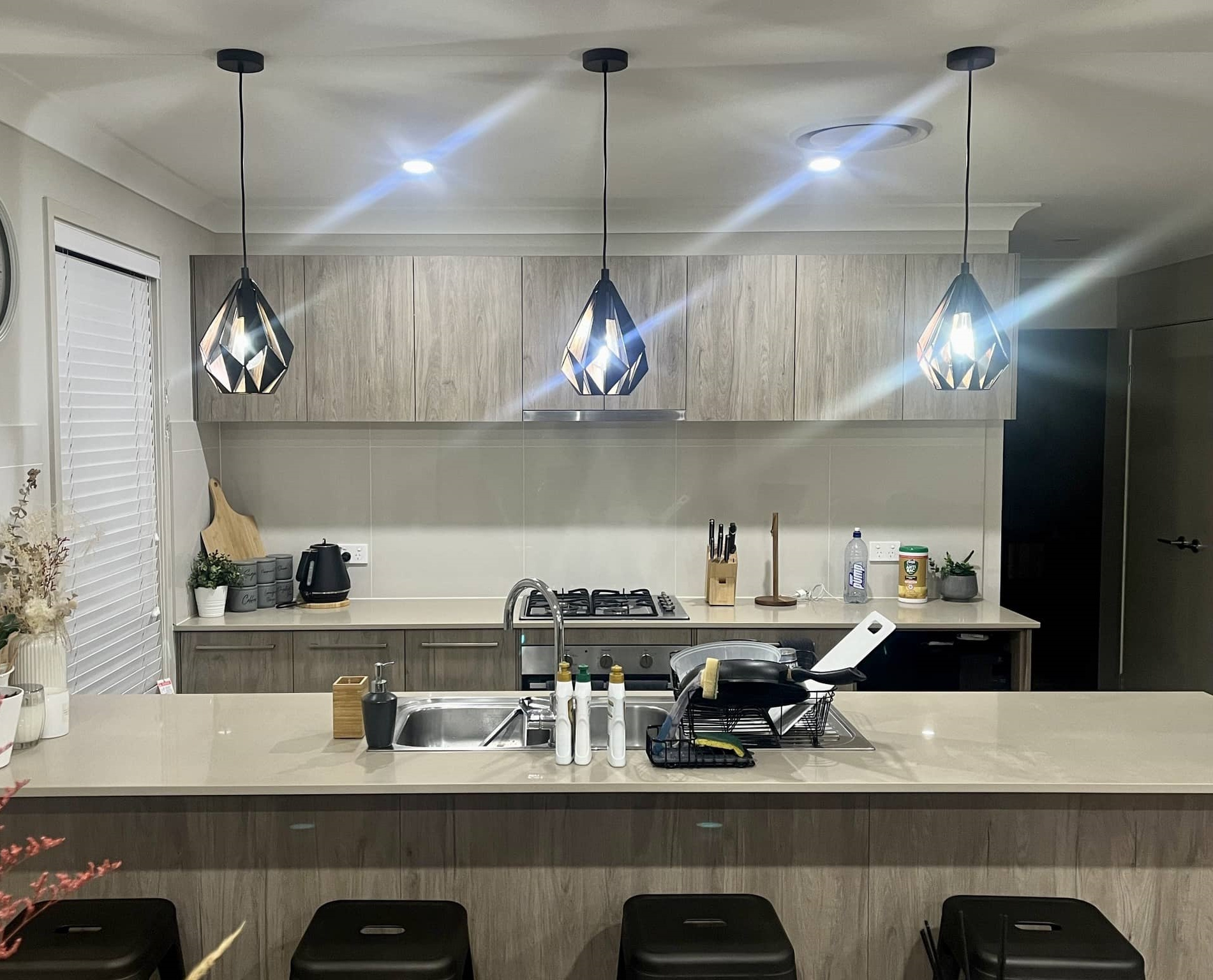 Professional electrician lighting in kitchen